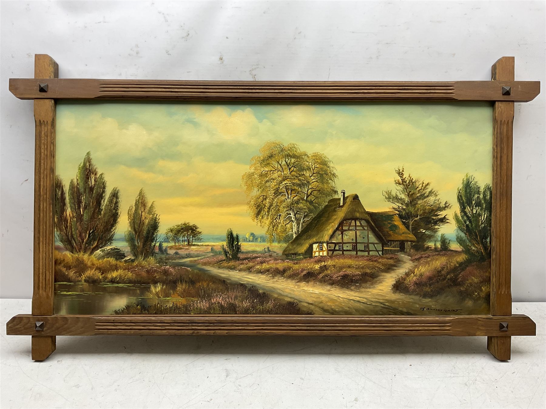 Horst Baumgart (German 1932-): Thatched Cottage I, oil on canvas signed 48cm x 98cm in cruciform oak Oxford frame