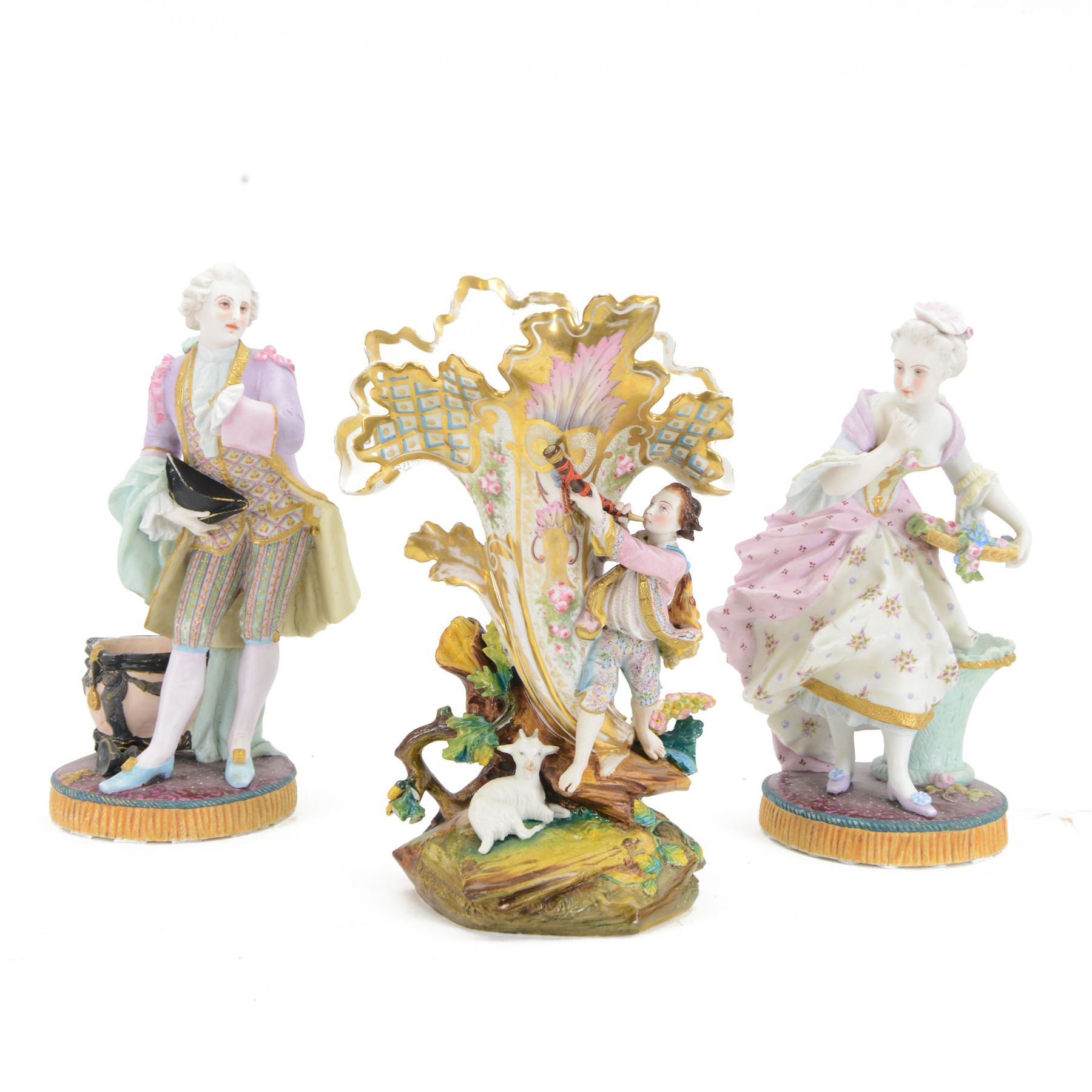 Pair of late 19th century French Letu & Mauger bisque figures, modelled as a gallant and his companion, with impressed marks beneath, H35.5cm, together with a 19th century French mantle vase, in the manner of Jacob Petit, the vase of cornucopia form painted with rose sprays and heightened with gilt, mounted with the figure of a trumpet player, upon a naturalistically modelled base mounted with a recumbent goat, H35cm