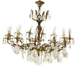 20th century Louis XV design gilt and patinated metal twelve-light chandelier, the foliate...
