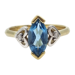  Gold marquise shaped topaz and heart design ring set with two diamonds, stamped 9   