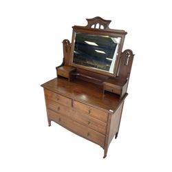 Art Nouveau mahogany dressing chest, arched pierced and carved pediment over raised swing mirror back with bevelled plate, two trinket drawers, base fitted with two short over two long drawers 
