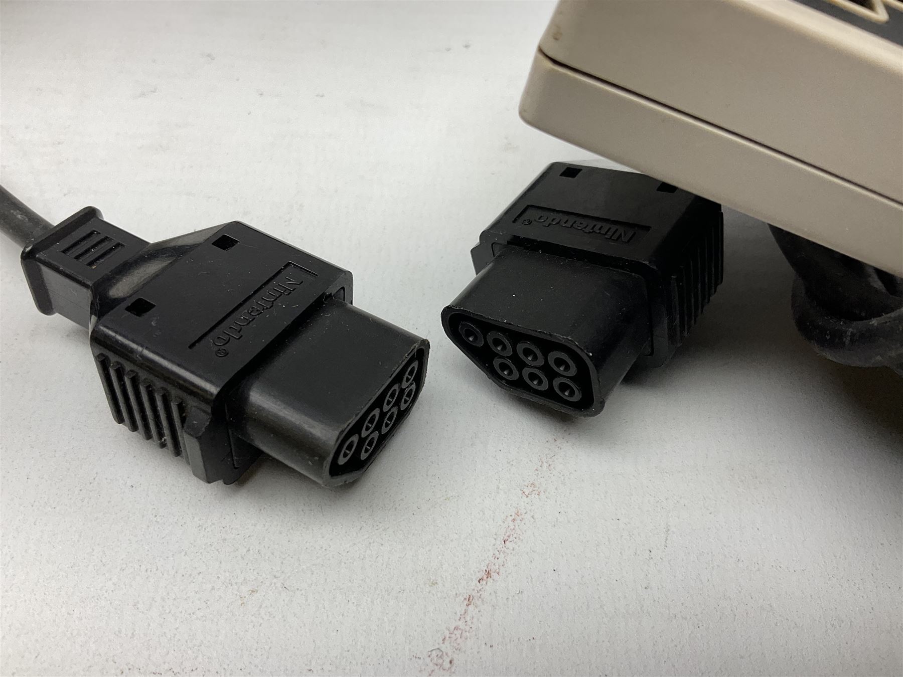 Nintendo Entertainment System (1985) console with two controllers, accessories and instruction booklet. NES Games ‘Duck Hunt’ with Nintendo Zapper gun, ‘Pinball’ and ‘Super Mario Bros.’, all with original sleeves and instruction booklets. NES game ‘Super Mario Bros. 2’ cartridge only