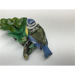 Minton majolica leaf dish, modelled as a Blue Tit perched on a branch with acorns and an oak leaf, date cypher for 1868, impressed marks beneath, L21cm. 