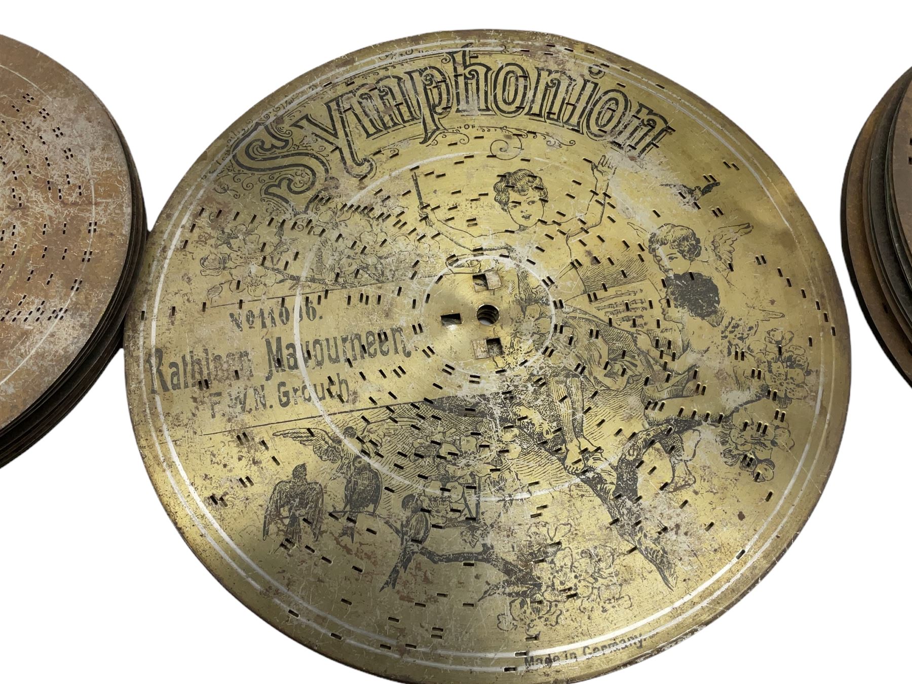 Late 19th century Symphonion disc musical box in inlaid walnut case with front lever action playing 25.5cm discs on a 10.5cm steel comb with forty-nine teeth, musical scene of cherubs under the lid, L33cm; together with five 25.5cm discs, fifteen 20.5cm discs and eleven 19cm discs