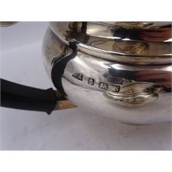 1930s three piece silver tea service, comprising teapot, milk jug and twin handled open sucrier, of oval bellied form, the teapot with Bakelite type handle and finial, hallmarked William Adams Ltd, Birmingham 1937, teapot H16cm