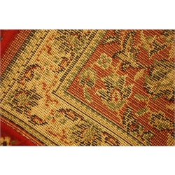  Two Persian design runner rugs, another rug and a wall hanging  