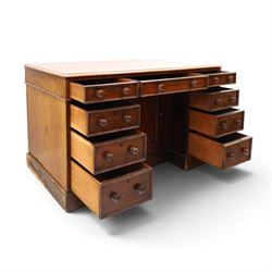 Victorian mahogany kneehole desk, rectangular top fitted with central frieze drawer over recessed cupboard, flanked by four graduating drawers to each side, on skirted base