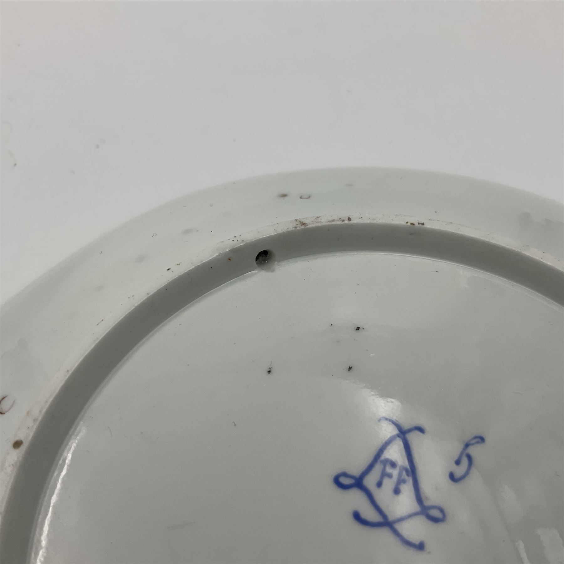 19th Sèvres style porcelain cup and saucer, the cup painted with a figural scene, against a scalloped border of scrolling floral swags on a blue ground, together with a Sèvres soft paste porcelain coffee can and saucer, painted with panels of exotic birds, roses and a border of cornflowers, LL monogram enclosing date letters H above painters mark, coffee can H6.5cm, saucer D13.5cm (2)