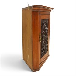 Edwardian walnut hanging corner cabinet, single panelled door with applied carved foliate decoration enclosing shelf 