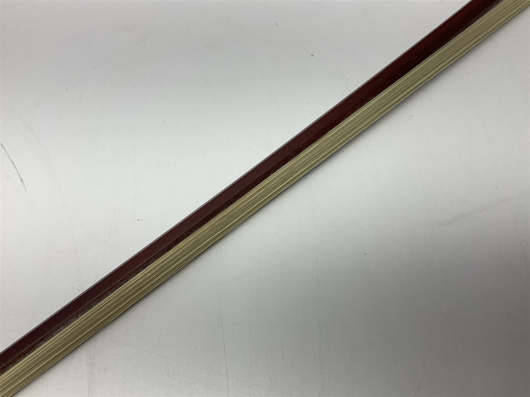 Nickel mounted pernambuco violin bow stamped R. Paesold L73.5cm