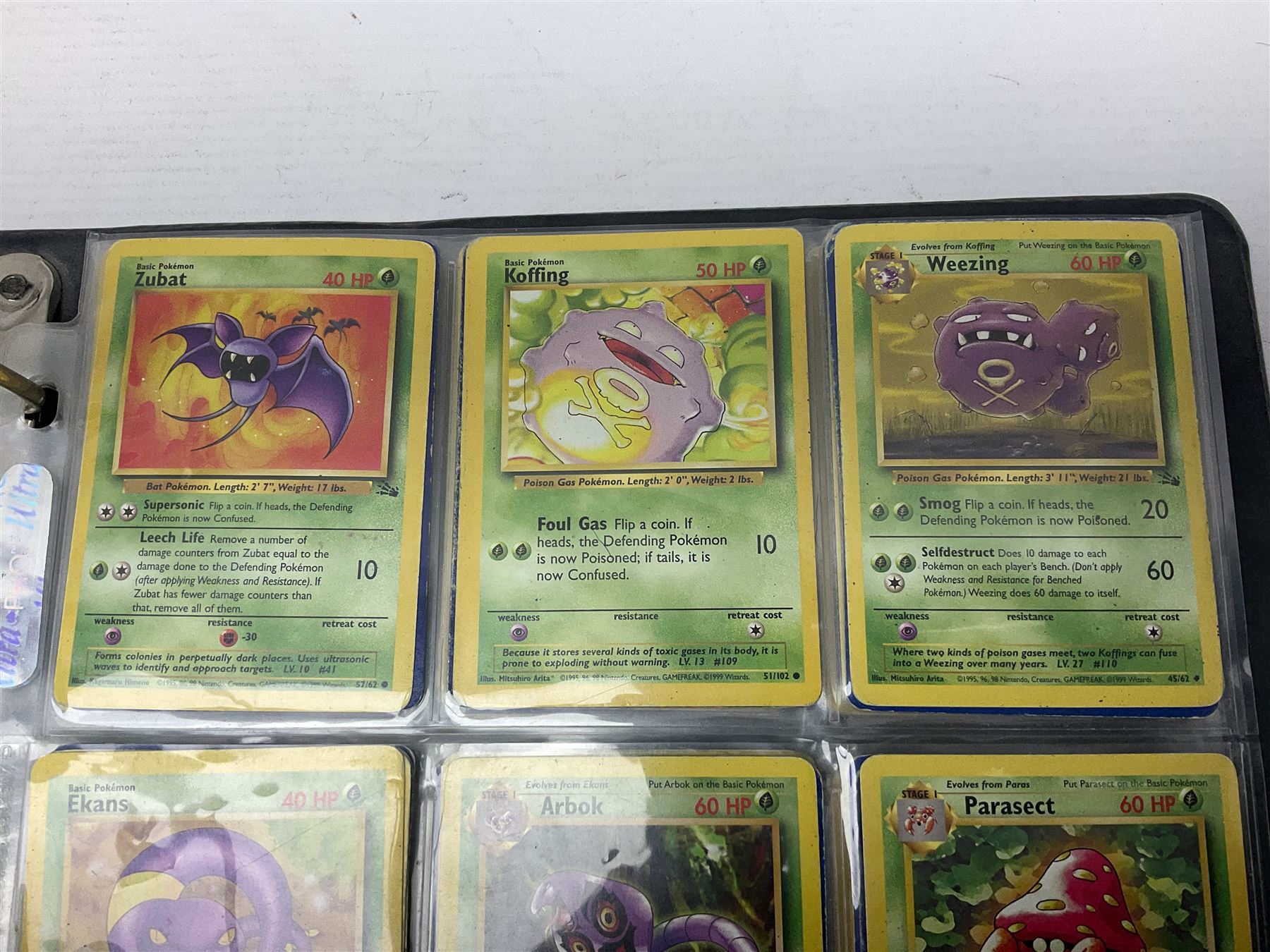 Collection of Pokemon trading cards, mostly 1999 Wizards Pokemon cards to include holo Charizard 4/102, first edition holo Machamp 8/102, further holographic cards; Dark Flareon 35/82 and Dark Vaporeon 45/82, cards from themed sets and 4th edition prints; 1998 Electronic Pokédex with cardboard boxes for themed decks Blackout, Overgrowth and Power Reserve Jungle, along with a large quantity of energy and trainer cards 