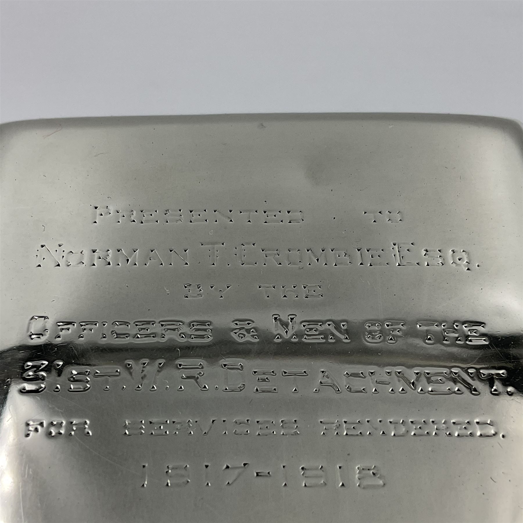 Edwardian silver mounted playing card case, hallmarked William Harrison Walter, Birmingham 1903, the sides each with a period playing card set behind a bevelled glass panel, the hinged cover with later engraving 'Presented to Norman T Crombie Esq by the officers & men of the 31st WR Detachment for services rendered 1917-1918', with red leather lined interior, the three compartments upon a sprung base and containing two later wooden Whist markers, case H12.5cm