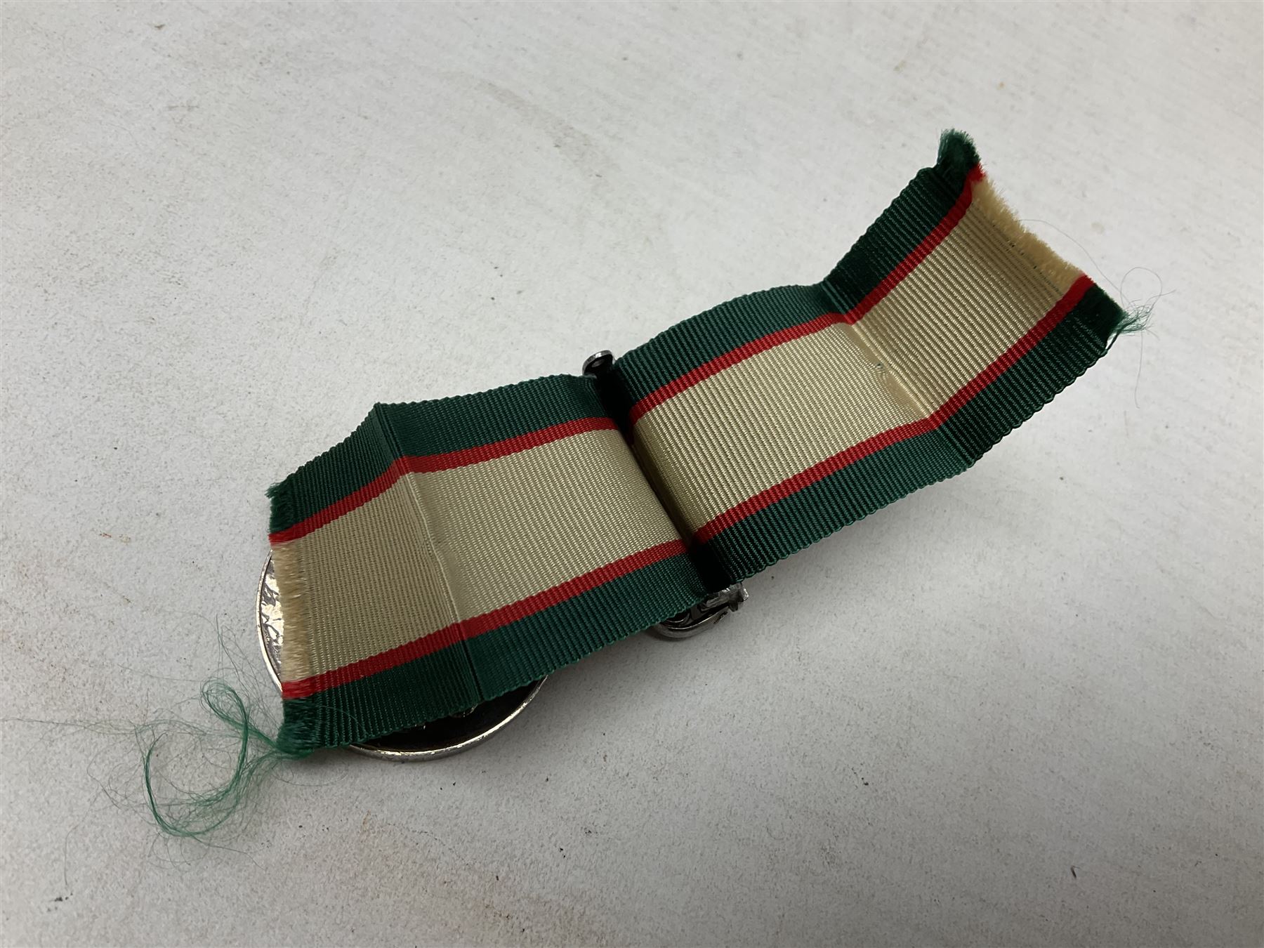 George VI India General Service Medal with North West Frontier 1936-37 clasp awarded to Bearer Khan Akbar 2-Border R.; with ribbon