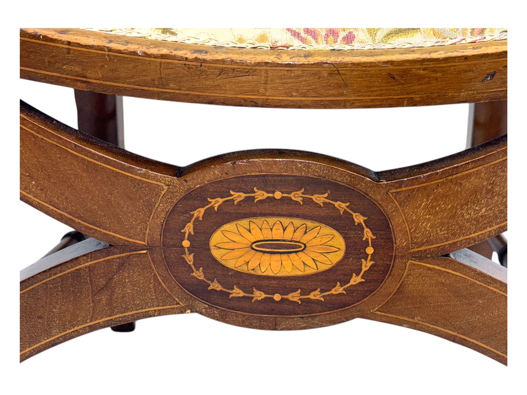 Edwardian inlaid mahogany X-frame armchair, upholstered seat and shield-back, curved front supports united by turned H-stretcher (W57cm, D58cm, H94cm); similar inlaid mahogany armchair, raised on cabriole supports united by cross-stretcher (W62cm, D60cm, H82cm) 
