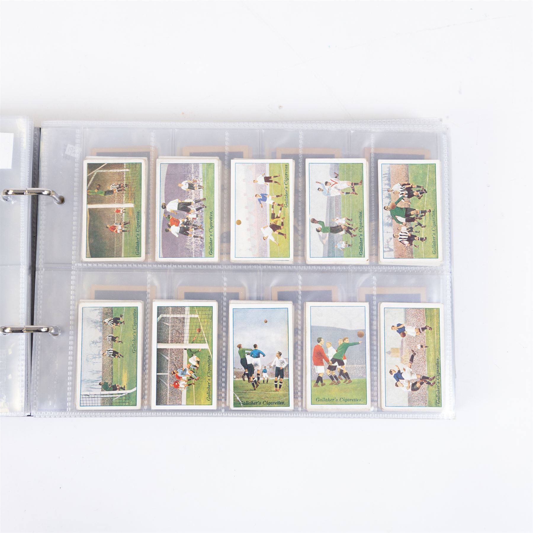 Collection of Edwardian and later Football related trading and cigarette cards, including forty-nine of fifty 1906 Ogden's Football Club Colours, 1922 PALS Footall series, ninety of one hundred 1925 Gallaher Famous Footballers, complete set of forty-four 1926 Ogden's Captains of Association Football Clubs and Colours, complete set of fifty 1927 Players Football Caricatures by MAC,  complete set of fifty 1927 Players Football Caricatures by RIP,  complete set of fifty 1930 Players Association Cup Winners, complete set of 50 1933 Ogdens AFC Nicknames etc, housed in brown cigarette card album