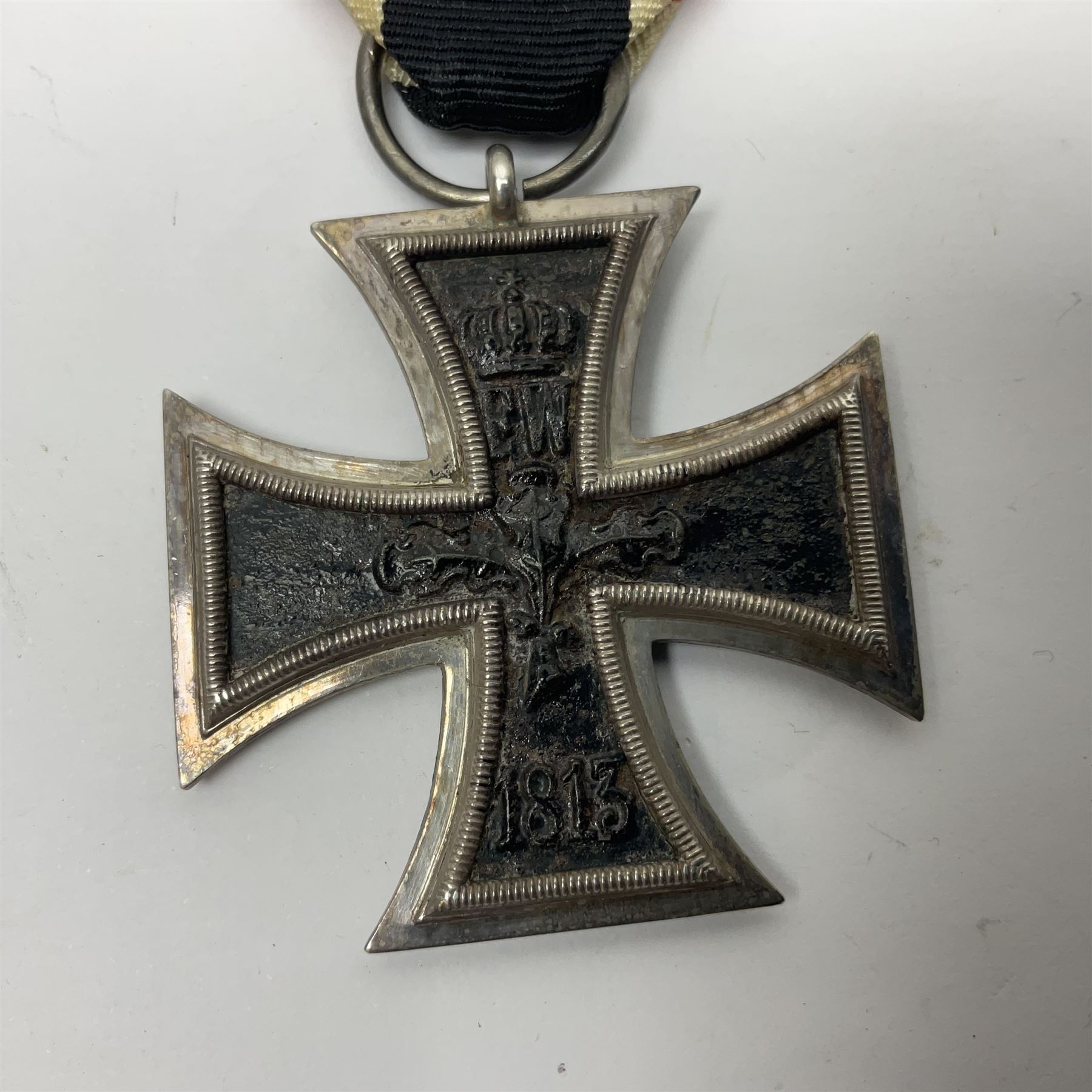 WWI Imperial German Iron Cross 2nd Class, the suspension ring indistinctly stamped M8?; with WWII ribbon