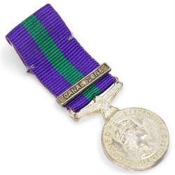 To: 22596749  Gunner A Lodge, Royal Artillery Elizabeth II General Service Medal with Canal Zone clasp, framed, the dress miniature, Royal Hong Kong Yacht Club badge, framed and a poster for M.C.C match against H.R.H. Yang di-Pertuan Besar's XI including Alan Lodge, framed