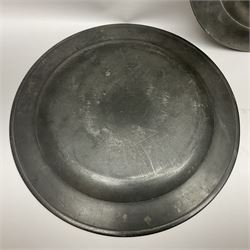 Group of seven 19th century pewter chargers, each of circular form with dished centre, two examples with touch marks verso, each approximately D39cm