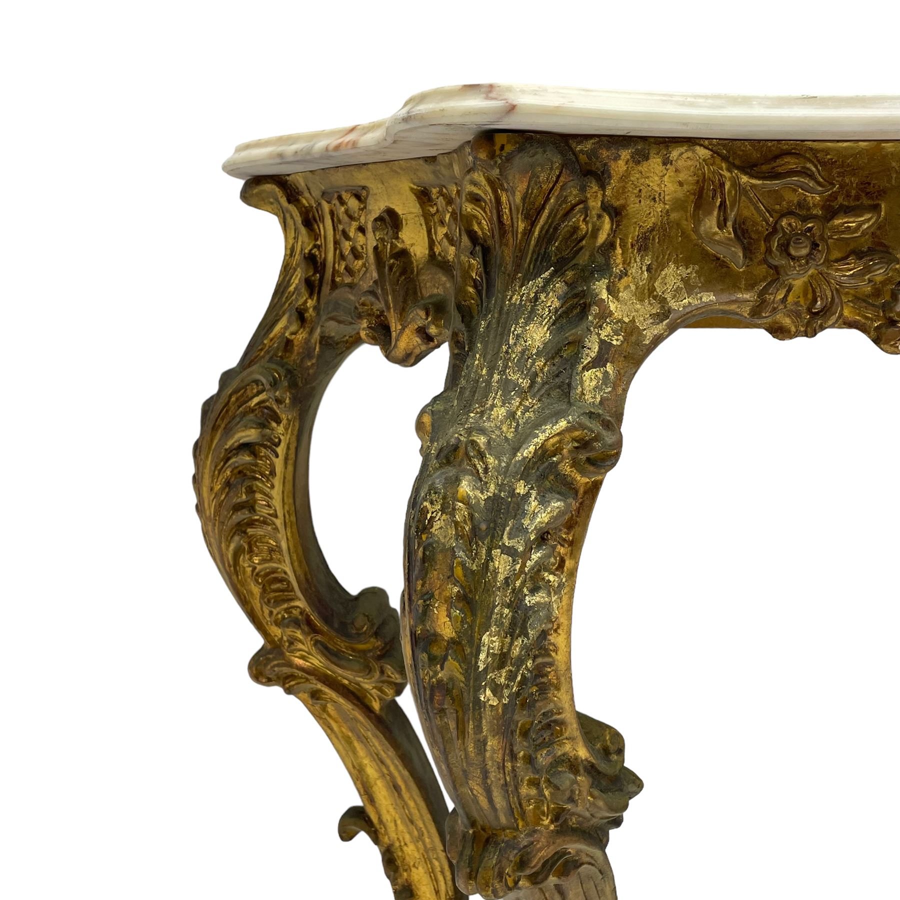 French Rococo design console or pier table, shaped and moulded pale marble top, the apron carved with pierced shell and scrolling acanthus leaves, extending flower head decoration, on four acanthus carved cabriole supports with scrolled terminals, united by shell moulded stretcher rails with central scrolled foliage cartouche 