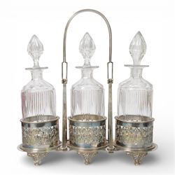 Late 19th century silver plated Silber & Fleming triple decanter stand, the three cut glas...