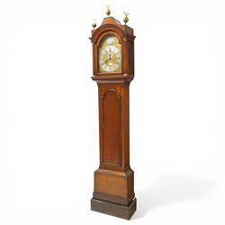 18th century oak eight-day longcase clock,  signed James Smyth, Saxmundham, the arched hood with brass ball and eagle finials, moulded arch pediment over turned columns, brass dial with silvered Roman chapter ring, Arabic minute track, matted centre with subsidiary seconds dial and calendar aperture, engraved boss to arch, the trunk with arched panel door, on stepped plinth base, with two weights and pendulum