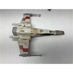 Star Wars - four space/land vehicles comprising Millenium Falcon with hinged top and figures; TIE Fighter; X-Wing Fighter with pilot; and AT-ST 'Chicken Walker' transporter; all unboxed (4)