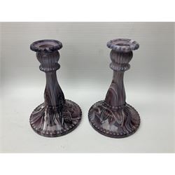 Daum glass two stemmed candle stick signed to verso, together with a pair of slag glass purple candle sticks, Daum H21cm