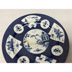 Mid-late 18th century pair of blue and white plates, probably Bow, the powder blue ground reserved with central roundel painted with Chinese river scenes surrounded by alternating fan shaped panels similarly decorated, and smaller roundels painted with floral sprays, with pseudo Chinese character marks to reverse, together with a Chinese plate decorated with blue and white peony design, all a/f, largest D22cm