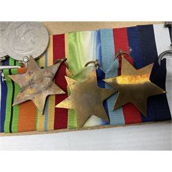 WW2 Royal Naval group of eight medals comprising OBE, hallmarked silver Distinguished Service Cross inscribed verso Lieut. J.R. McCluskie RNVR 1945, 1939-1945 Star, Atlantic Star, Africa Star, 1939-1945 War Medal, Defence Medal and Royal Naval Patrol Service Medal inscribed Lieutenant J.R. McCluskie Royal Naval Patrol Service; with seven original photographs of a sea battle 27th November 1940 against the Italian Fleet and another photographic postcard of Sir Stafford Cripps arriving on board one of the vessels.