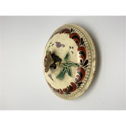 18th century creamware teapot, probably Leeds, with reeded entwined handle and floral finial to the cover, the body with hand painted polychrome decoration of figure to one side, and floral spray to the other, collectors paper label beneath inscribed Leeds Pottery, H11.5cm