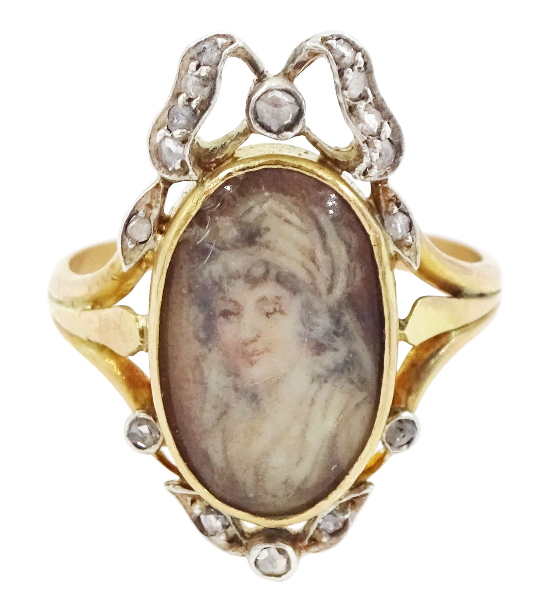 19th century gold and silver diamond portrait ring, set with an oval miniature of a woman on ivory, under a glazed panel, with rose cut diamond bow and floral sprigs below, to trifuricated shoulders. This lot has been registered for sale under Section 10 of the APHA Ivory Act