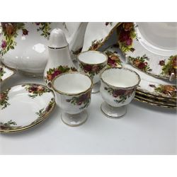 Royal Albert Country Roses pattern part tea and dinner service, to include teapot, four cups and saucers, four dessert plates, cake plate etc, (41)