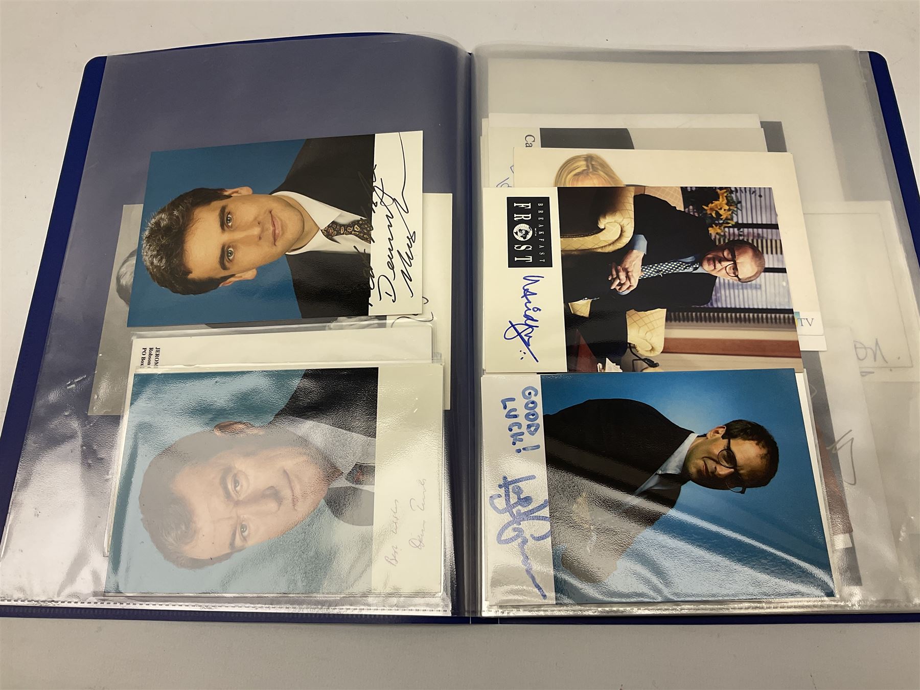 Two folders of over fifty photographs, cards, compliment slips etc of actors, actresses, celebrities, politicians, sports personalities etc, all bearing signatures, including David Frost, Lloyd Grosman, John Suchet, Julia Somerville and othe GMTV presenters, Carol Vorderman, Jackie Collins, Rolf Harris, Timothy Dalton, Pete Postlethwaite, Magnus magnusson, John Major, Kate Moss, Uri Geller, David Beckham, Peter Alliss, Sharon Davies, Kevin Keegan etc