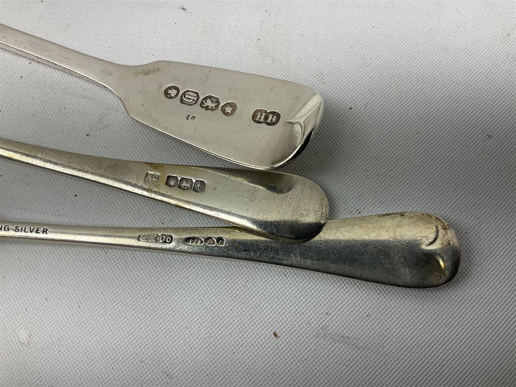 Two small silver page markers in the form of trowels, both hallmarked, together with a small silver and enamel dish, decorated with central panel of flowers, with London import mark, and a small group of flatware, to include Victorian salt spoon, approximate gross weight 111.6 grams