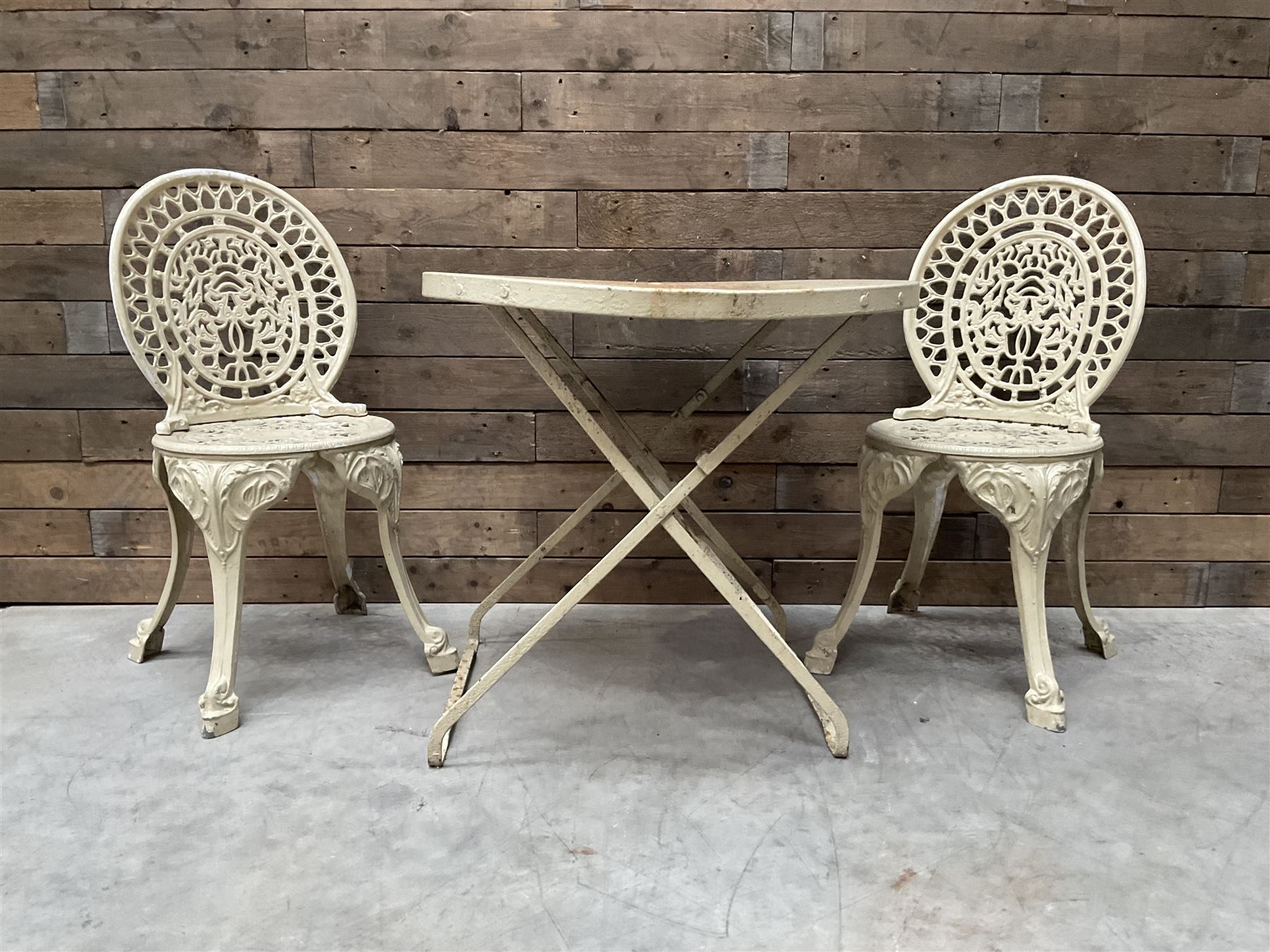 Circular cast aluminium garden table (D74cm, H68cm), and two chairs