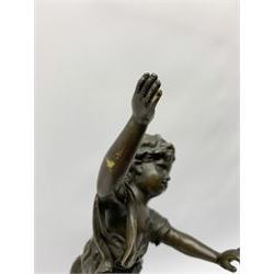 After E Plat, bronze modelled as a dancing child, signed E. Plat, upon cylindrical black marble base, H40cm