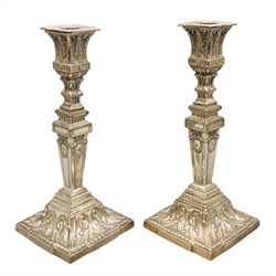  Pair Victorian Sheffield plate candlesticks with pierced scroll work, tapered stem decorated with ribbon tie swags on a beaded scroll square bases, H30cm (2)  