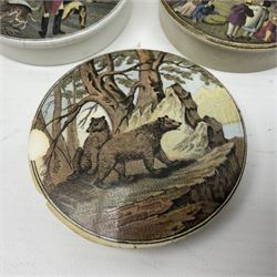 Six 19th century Prattware pot lids comprising 'The Village Wakes', three 'Bear on Rock', 'Shooting Bears' and 'Bear, Lion and Cock', two with associated bases, largest D9cm (6)