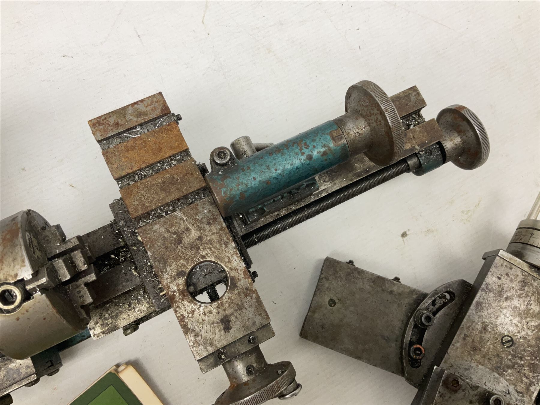 Cowells of Norwich model 90 modelmaker's lathe with handbook, the Pratt Bernard 4-jaw chuck with 4cm centre height and 7.5cm throw L44.5cm; together with an unrelated Hobbymat horizontal cross-slide with 4-way tool post (2)