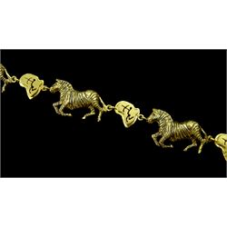18ct gold zebra and hunting scene link bracelet, stamped 750