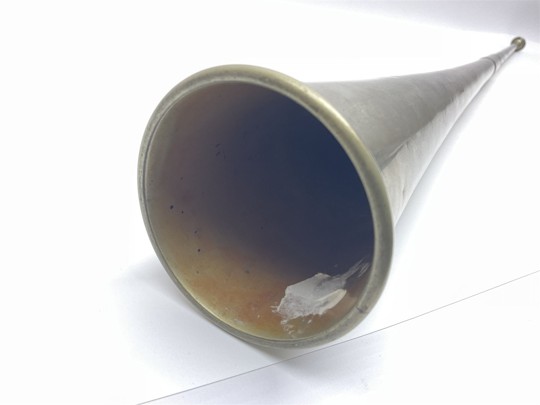 19th century telescopic hunting horn, the bell engraved 'The Beaufort', with makers mark Kohler & Son, makers, 61 Victoria Street, Westminster (from Covent garden) London, in a leather sheath, horn full extended L91cm 