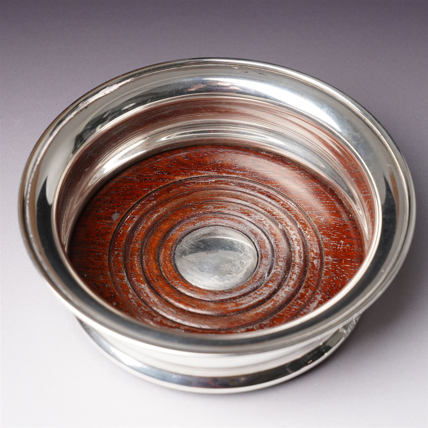 Pair of silver bottle coasters with turned wooden bases D13.5cm Birmingham 1969 Maker Barker Bros.Silver Ltd 