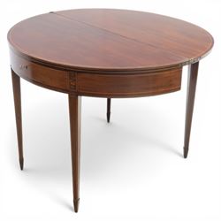 George III Scottish inlaid mahogany demi lune tea table, the curved fold over top opening to reveal a circular top with inlay to edge, above a frieze drawer with key, raised upon tapering inlaid legs with spade feet