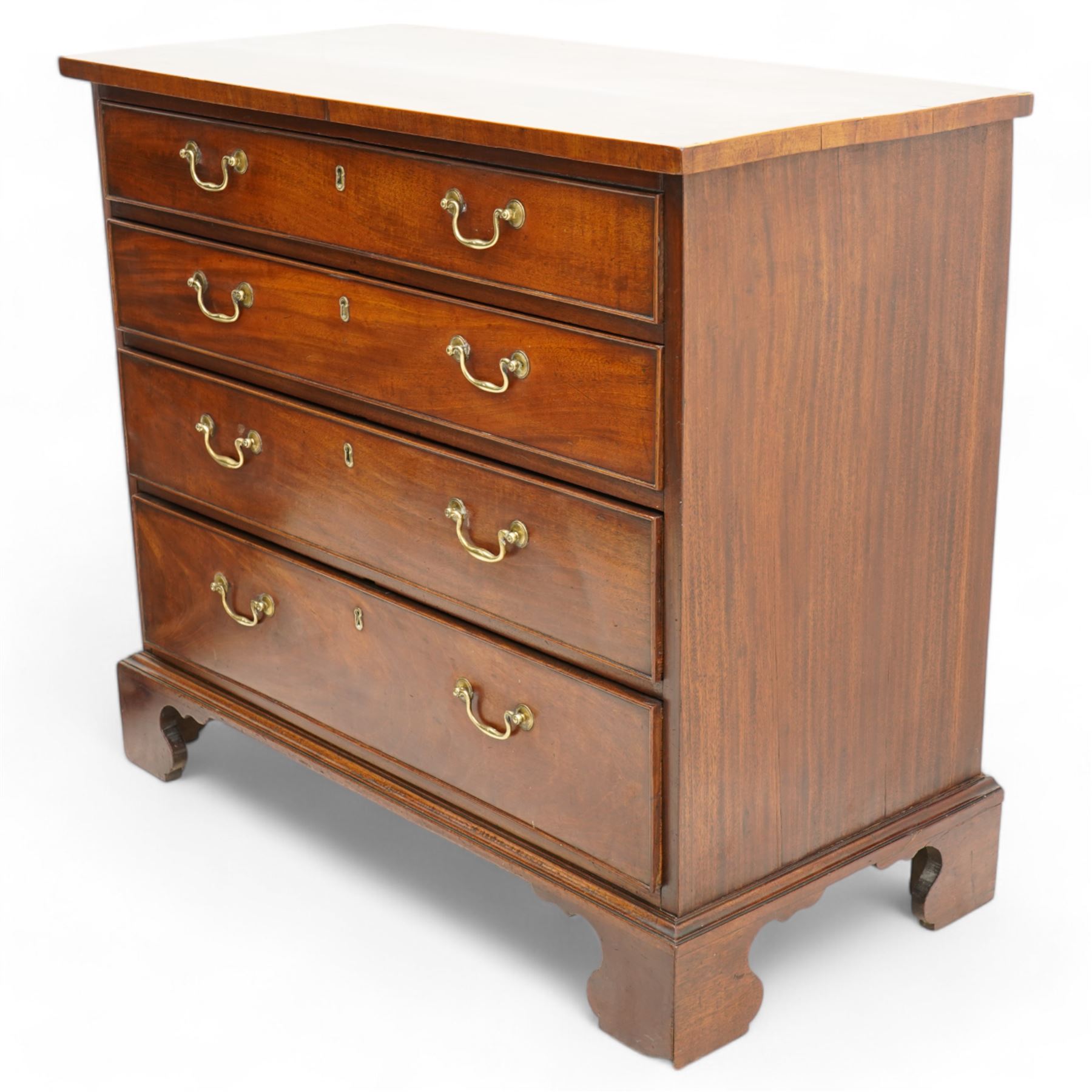 George III mahogany chest, rectangular top over four long cock-beaded drawers, fitted with brass swan neck handles and circular plates, lower moulding over bracket feet 