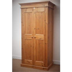  Solid pine double wardrobe enclosed by two panelled doors, W98cm, H197cm, D67cm  