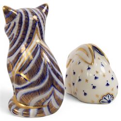 Three Royal Crown Derby paperweights, comprising Seated cat, Rabbit and Sleeping cat, all with gold stoppers 