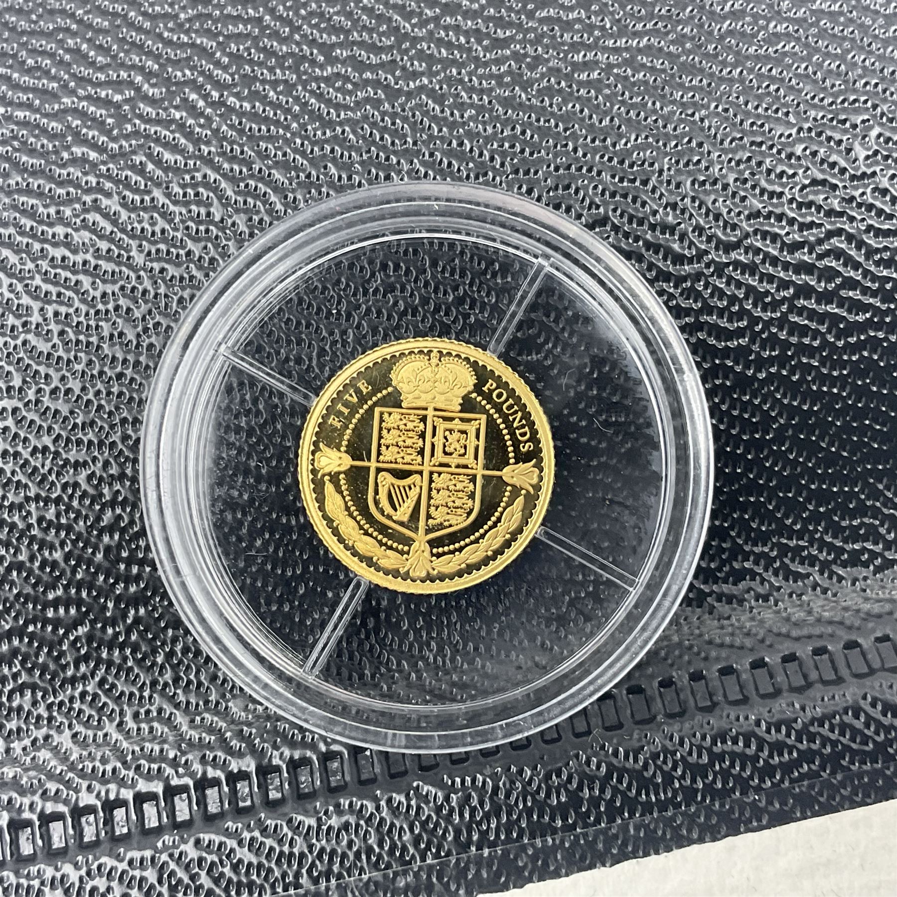 Eleven Queen Elizabeth II miniature gold coins, each being 0.5 grams of 24 carat gold, including Tristan da Cunha 2020 'Laurel', Solomon Islands 2020 '80th Anniversary of the Battle of Britain' etc, all with certificates