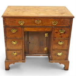George II figured walnut kneehole desk, the rectangular book-matched veneer top with feath...