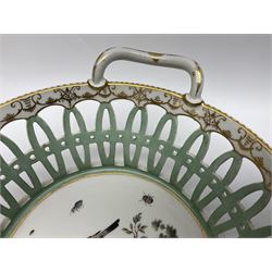 Pair of 19th century German openwork chestnut baskets, with twin handles and scrolling gilt border and star rim, painted to the centre with birds and insects, D22cm 