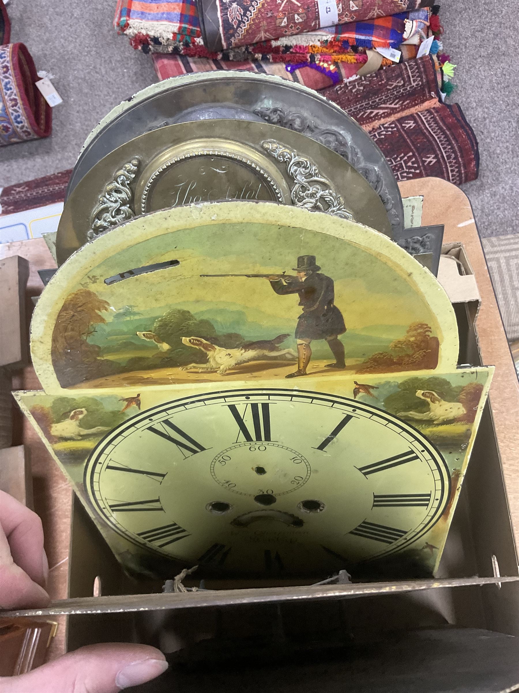 Approximately thirteen longcase clock faces, mainly 18th and 19th century, including brass and painted dials